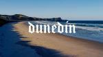 Dunedin logo on&nbsp;beach